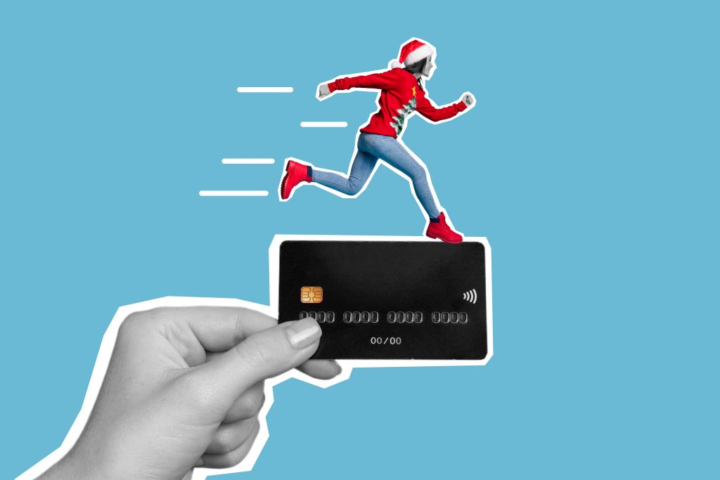 Creative college of person in holiday clothing running on a credit card
